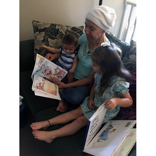 Amy and her best buddies, our grandchildren Genevieve and Cayde, about two months before she died. Time like this was all Amy ever wanted out of life. It always made her happy. Amy's Scrapbook: Amy reading to grandkids